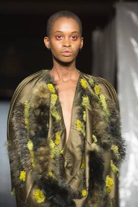 London, UK. 19 09 2015. Runway show of designer James Kelly at Fashion Scout during London Fashion Week. The designs feature moss and fine feathers. London Fashion Week, James Kelly at Fashion Scout, London, UK 