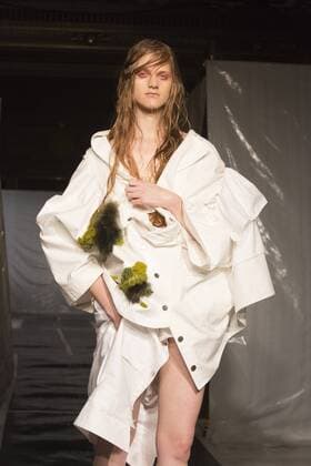 London, UK. 19 09 2015. Runway show of designer James Kelly at Fashion Scout during London Fashion Week. The designs feature moss and fine feathers. London Fashion Week, James Kelly at Fashion Scout, London, UK 
