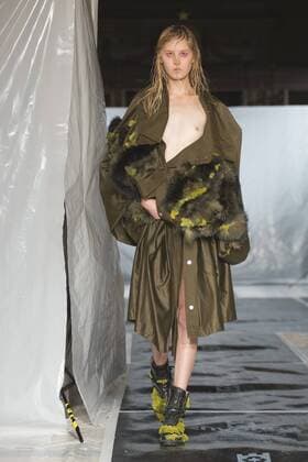 London, UK. 19 09 2015. Runway show of designer James Kelly at Fashion Scout during London Fashion Week. The designs feature moss and fine feathers. London Fashion Week, James Kelly at Fashion Scout, London, UK 