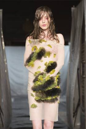 London, UK. 19 09 2015. Runway show of designer James Kelly at Fashion Scout during London Fashion Week. The designs feature moss and fine feathers. London Fashion Week, James Kelly at Fashion Scout, London, UK 
