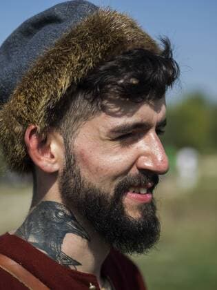 Sept. 19, 2015 - Enactors in medieval Scandinavian clothes with a crow on his neck tattoo -- In the historical festival Civilization in Kiev, Ukraine have been replicated the history of revolutions, way of life and the atmosphere of centuries since antiquity and the middle of the twentieth century - ZUMAg154