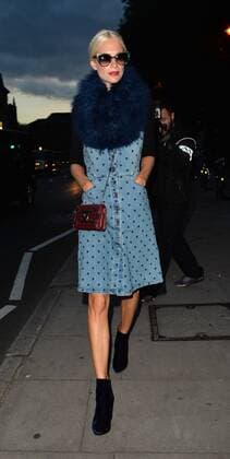 Model Poppy Delevingne is pictured arriving at the House of Holland show at London Fashion Week. The 29-year-old wears a denim dungaree-style dress, velvet ankle boots and as seriously fluffy scarf. SEPTEMBER 19th 2015  LTNx152921