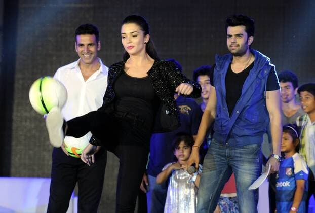 GURGAON, INDIA - SEPTEMBER 20: Bollywood actors Akshay Kumar, Amy Jackson and Manish Paul during the HT GIFA (Hindustan Times Great Indian Football Action) grand opening ceremony event in Tau Devi Lal stadium, on September 20, 2015 in Gurgaon, India. HT GIFA organized to encourage and kickstart an event that promises to be the perfect launch pad for some promising football talent of the Delhi-NCR and Gurgaon region. (Photo by Parveen Kumar Hindustan Times ) Hindustan Times Great Indian Football Action Opening Ceremony In Gurgaon