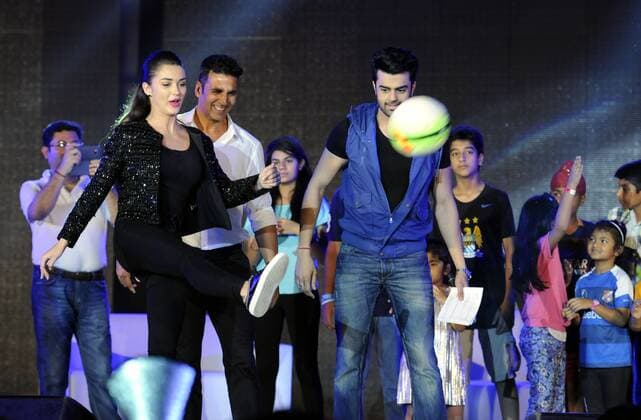GURGAON, INDIA - SEPTEMBER 20: Bollywood actors Akshay Kumar, Amy Jackson and Manish Paul during the HT GIFA (Hindustan Times Great Indian Football Action) grand opening ceremony event in Tau Devi Lal stadium, on September 20, 2015 in Gurgaon, India. HT GIFA organized to encourage and kickstart an event that promises to be the perfect launch pad for some promising football talent of the Delhi-NCR and Gurgaon region. (Photo by Parveen Kumar Hindustan Times ) Hindustan Times Great Indian Football Action Opening Ceremony In Gurgaon