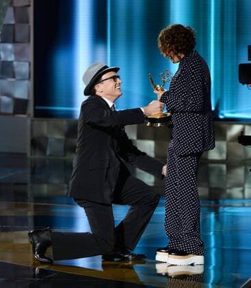 Actor Bradley Whitford presents the award to writer director Jill Soloway onstage during the 67th Primetime Emmy Awards in the Microsoft Theater in Los Angeles on September 20, 2015.  LAP20150920670 KENxMATSUI