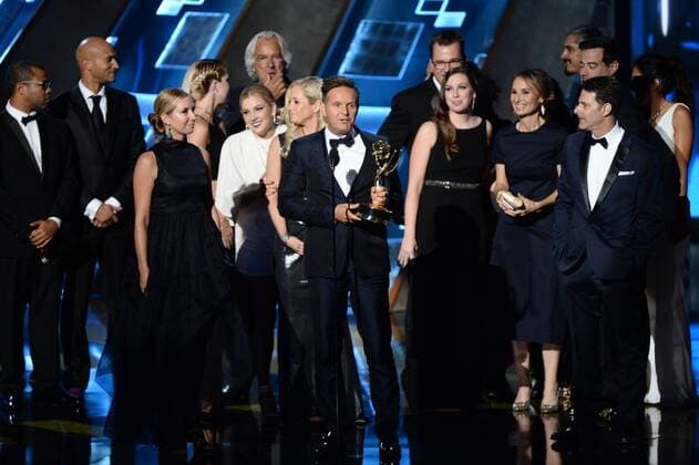 Producer Mark Burnett (C) with crew members accept the award for Outstanding Reality-Competition Program for The Voice onstage during the 67th Primetime Emmy Awards in the Microsoft Theater in Los Angeles on September 20, 2015.  LAP20150920711 KENxMATSUI