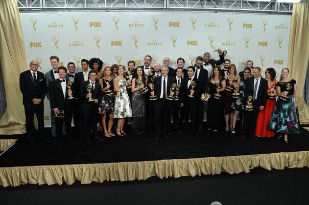 Jon Stewart (C) and the writers of The Daily Show with Jon Stewart , winners of Outstanding Variety Talk Series and Outstanding Writing for a Variety Series pose in the photo room at the 67th Primetime Emmy Awards in the Microsoft Theater in Los Angeles on September 20, 2015.  LAP2015092213 JIMxRUYMEN