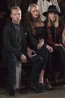 London, UK. 20 09 2015. L-R: Ronan Keating, Storm Keating (formerly Storm Uechtritz) and Mollie King attend the London Fashion Week SS16 ready-to-wear runway show of label Pringle of Scotland at the St Pancras Renaissance Hotel. London Fashion Week, Pringle of Scotland, London, UK 