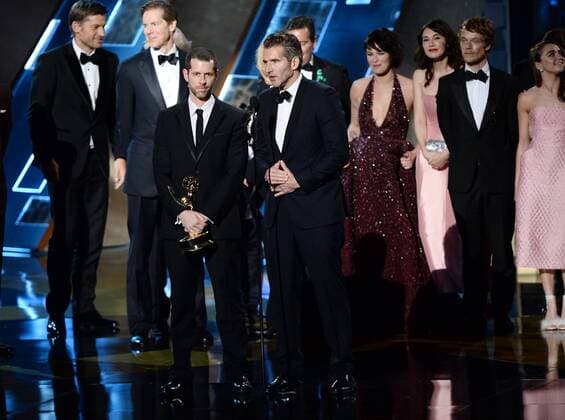 Writer producers David Benioff and D.B. Weiss (C) with cast and crew accept the award for Outstanding Drama Series for Game of Thrones onstage during the 67th Primetime Emmy Awards in the Microsoft Theater in Los Angeles on September 20, 2015.  LAP20150920785 KENxMATSUI