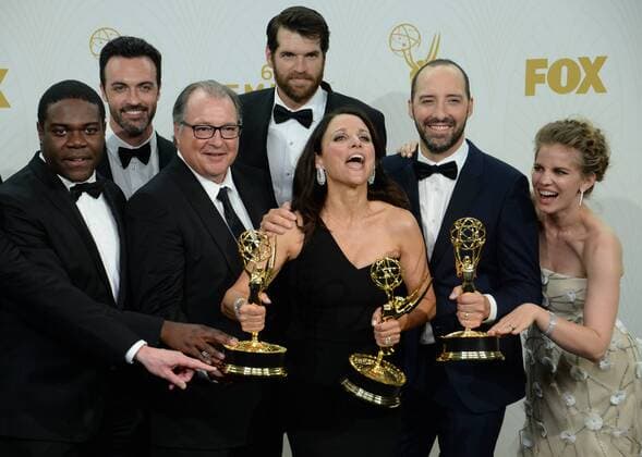 The cast and crew of Veep , crowd the photo room as Julia Louis-Dreyfus (C) holds her Emmys at the 67th Primetime Emmy Awards in the Microsoft Theater in Los Angeles on September 20, 2015.  LAP20150920236 JIMxRUYMEN