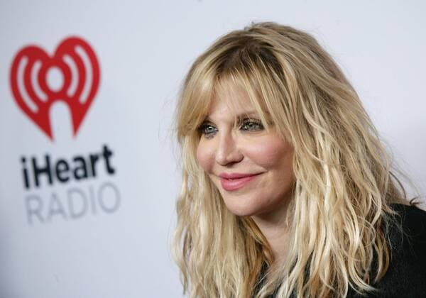 Courtney Love arrives in the press room for the iHeartRadio Music Festival at the MGM Grand Hotel in Las Vegas, Nevada on September 18, 2015.  LAV20150918108 JAMESxATOA