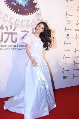 BEIJING, CHINA - SEPTEMBER 22: (CHINA OUT) Actress Angelababy poses on the red carpet during the Zhang Shuai 2016 S S Collection & Haute Couture at National Agricultural Exhibition Center on September 22, 2015 in Beijing, China.  CFP473290405
