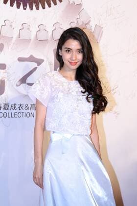 BEIJING, CHINA - SEPTEMBER 22: (CHINA OUT) Actress Angelababy poses on the red carpet during the Zhang Shuai 2016 S S Collection & Haute Couture at National Agricultural Exhibition Center on September 22, 2015 in Beijing, China.  CFP473290406