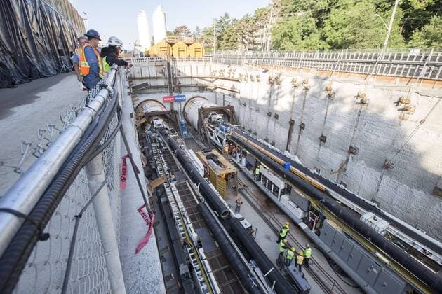 Sept. 24, 2015 - Toronto, ON, Canada - TORONTO, ON - SEPTEMBER 24 - Workers look at two large boring machines on Eglinton Ave. East, where they will soon begin boring toward Yonge St. The Crosstown is a light rail transit (LRT) line that will run across Eglinton Avenue between Mount Dennis (Weston Road) and Kennedy Station. This 19-kilometre corridor will include a 10-kilometre underground portion, between Keele Street and Laird Drive. September 24, 2015. Toronto Canada  - ZUMAt14_