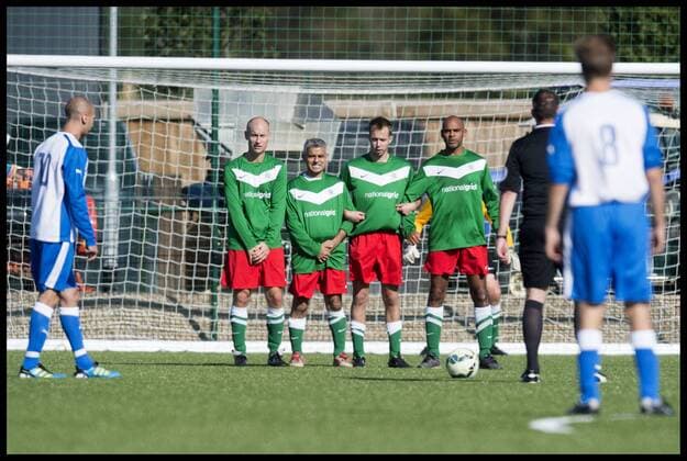 . 27 09 2015. Brighton, United Kingdom. Labour v Lobby Football Match at the American Express Community Stadium on day 1 of the Labour Conference in Brighton. Pictured are the labour team defending a free kick. Stephen Kinnock (left of wall) and Sadiq Khan (second left).  xBenxStevensx xi-Imagesx IIM-11108-0006