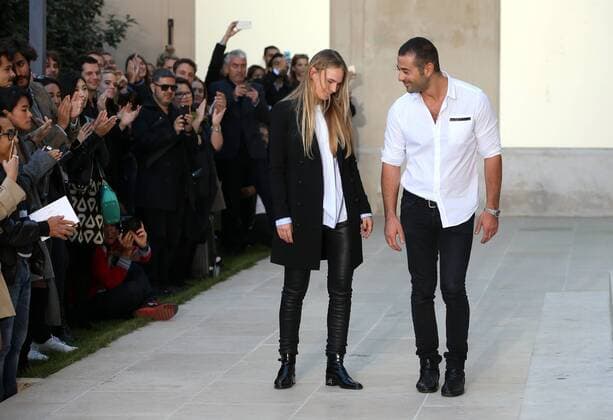Designers Ilan Delouis and Jenny Mannerheim (L) salute the audience at the end of the presentation of Each x Other s collection as part of the 2016 Spring-Summer ready-to-wear Fashion Week in Paris, on September 29, 2015.  PAR20150929101 MAYAxVIDON-WHITE
