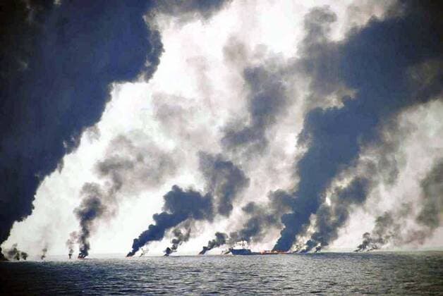 June 19, 2010 - Gulf Of Mexico, LA, United States of America - Dark clouds fill the sky as shrimp boats use a boom to gather crude oil during a controlled surface burn following the BP Deepwater Horizon oil spill disaster as efforts to contain and clean the millions of gallons of crew continue June 19, 2010 in the Gulf of Mexico. Gulf Of Mexico United States of America - ZUMAp138