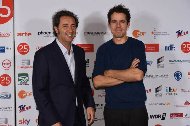 Der italienische Filmemacher Paolo Sorrentino, l-r, und der Regisseur Tom Tykwer kommen am 01.10.2015 in Köln zur Preisverleihung der 25. Cologne Conference. Ausgezzeichnet werden herausragende Leistungen aus der internationalen Film- und Fernsehbranche. Vom 25.09. bis 01.10. findet das Festival für herausragendes Fernsehen und unabhängige Filmkultur in Köln statt.