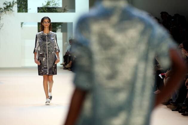 A model takes to the catwalk during the presentation of Akris collection as part of the 2016 Spring-Summer ready-to-wear Fashion Week in Paris, on October 4, 2015.  PAR20151004102 MAYAxVIDON-WHITE
