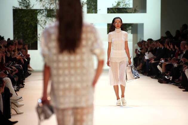 A model takes to the catwalk during the presentation of Akris collection as part of the 2016 Spring-Summer ready-to-wear Fashion Week in Paris, on October 4, 2015.  PAR20151004110 MAYAxVIDON-WHITE
