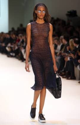 A model takes to the catwalk during the presentation of Akris collection as part of the 2016 Spring-Summer ready-to-wear Fashion Week in Paris, on October 4, 2015.  PAR20151004103 MAYAxVIDON-WHITE