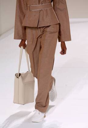 A model takes to the catwalk during the presentation of Hermes collection as part of the 2016 Spring-Summer ready-to-wear Fashion Week in Paris, on October 5, 2015.  PAR20151005115 ECOxCLEMENT