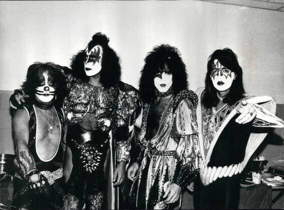 Jan. 09, 1974 - The Men in the Iron masks: When they arrived in Sydney recently for a series of concert. American rock band Kiss were without their familiar grease-paint disguise. But they took a page out of Australian folk-lore to help them keep their identities concealed. The group, who have always shunned photographers trying to capture their real appearance, arrived sporting Ned Kelly style iron masks, as worn by the legendary Australian bandit. Photo shows the group Kiss in their more familiar guise. - ZUMAk09_