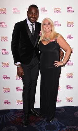 The Breast Cancer Care Fashion Show 2015 London, UK. Ben Ofoedu and Vanessa Feltz at The Breast Cancer Care Fashion Show at Grosvenor House, Park Lane, London on Wednesday 7 October 2015. LMK392 -58339-081015 