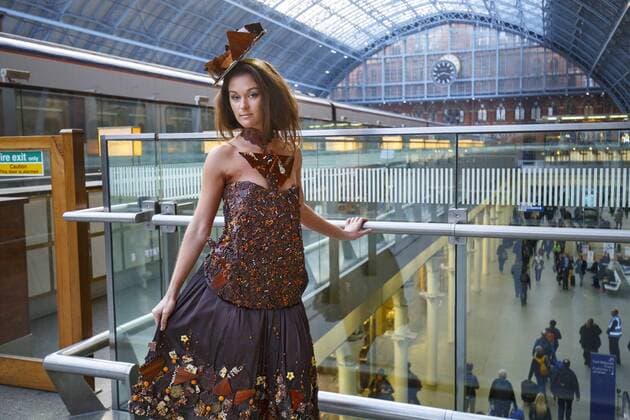 Oct. 12, 2015 - London, London, UK - London, UK. Models dressed in clothing made entirely from chocolate showcasing The Chocolate Show s fashion collection at St Pancras International station on Monday, 12 October, 2015. London UK  - ZUMAl94_