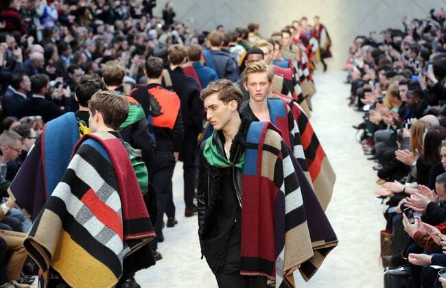 Burberry shares plunge; FTSE 100 trades higher. SOurce - BBC NEWS Burberry Prorsum show at London Mens Fashion Week for Autumn Winter 2014, Wednesday, 8th January 2014.  xStephenxLockx xi-Imagesx IIM-11235-0001