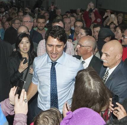 Liberal leader Justin Trudeau greets supporters during a final rally attended by several thousand on the last day in the summer fall federal election campaign in North Vancouver, British Columbia, October 18, 2015. Voters go to the polls tomorrow, October 19, 2015.  VAP2015101816 HEINZxRUCKEMANN