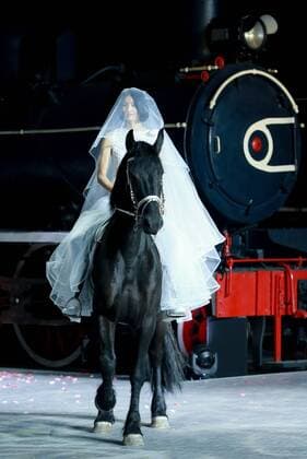 A model rides a horse to present the creation from Pierre Cardin 2016 spring summer collection during a fashion show held at China Railway Museum in Beijing, capital of China, Oct. 20, 2015. ) (wsw) CHINA-BEIJING-FASHION SHOW-PIERRE CARDIN (CN) ChenxJianli 