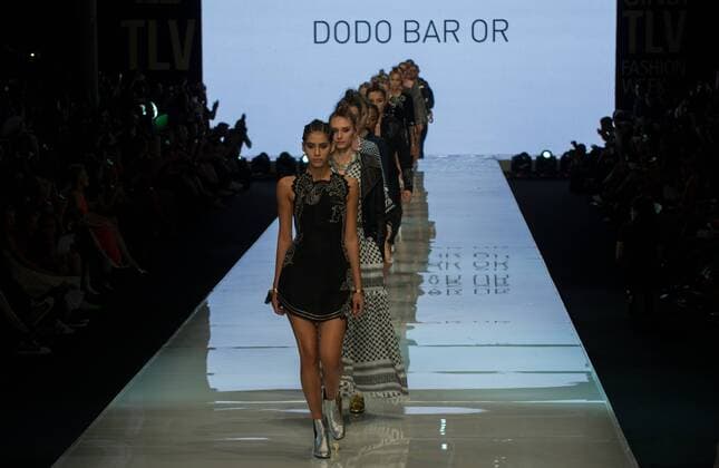 Models present creations of Dodo Bar Or during Gindi Tel Aviv Fashion Week in Tel Aviv, Israel, on Oct. 21, 2015. The four-day Gindi Tel Aviv Fashion Week ended here on Wednesday. ) ISRAEL-TEL AVIV-FASHION WEEK LixRui 