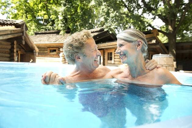 Happy senior couple in swimming pool at a spa model released Symbolfoto property released  TOYF001312