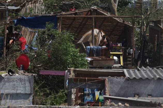 Oct. 24, 2015 - Mexico - A men of Punta Perula in the coast of Jalisco State carrying a camping trough the no walls house because hurricane Patricia. Hurricane Patricia the strongest hurricane ever recorded made landfall on Friday without causing the catastrophic damage that many had anticipated. That lack of destruction is in large part due to the storm™s record winds staying confined to a small area and hitting a relatively unpopulated region. Mexico - ZUMAp133