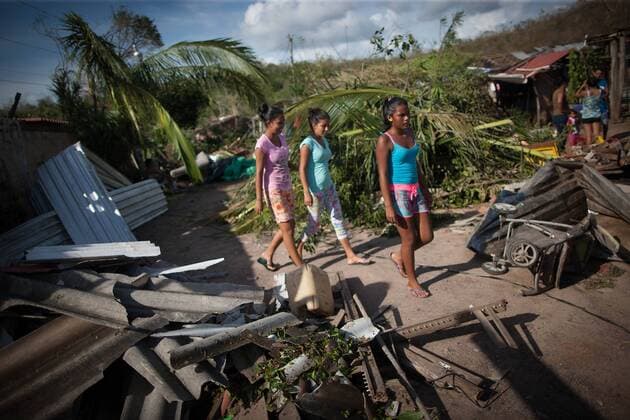Girls walk among debris after the passage of hurricane Patricia, in La Huerta, Jalisco state, Mexico, on Oct. 24, 2015. Several municipalities in the western Mexican state Jalisco on the Pacific coast on Saturday were still on alert as Hurricane Patricia lashed further inland and weakened to a tropical storm. Pedro Mera) (da) (fnc) MEXICO-LA HUERTA-ENVIRONMENT-HURRICANE e PEDROxMERA 
