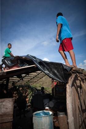Youngsters are seen on the roof of a house after the passage of hurricane Patricia, in La Huerta, Jalisco state, Mexico, on Oct. 24, 2015. Several municipalities in the western Mexican state Jalisco on the Pacific coast on Saturday were still on alert as Hurricane Patricia lashed further inland and weakened to a tropical storm. Pedro Mera) (da) (fnc) MEXICO-LA HUERTA-ENVIRONMENT-HURRICANE e PEDROxMERA 