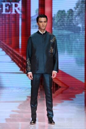 BEIJING, CHINA - OCTOBER 25: (CHINA OUT) A model showcases designs on the runway at NE-TIGER Haute Couture Collection during the Mercedes-Benz China Fashion Week S S 2016 at Beijing Hotel on October 25, 2015 in Beijing, China.  CFP474868177