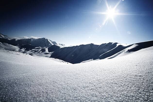 Austria, Tyrol, Ischgl, mountainscape in winter in backlight  ABF000639