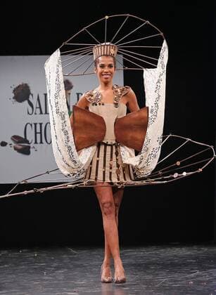 A model wears a creation made with chocolate during a fashion show at the inauguration of the 21st annual Salon du Chocolat in Paris on October 27, 2015. The show, the world s biggest dedicated to chocolate, brings together fashion designers and chocolatiers from around the world.  PAR20151027735 DAVIDxSILPA