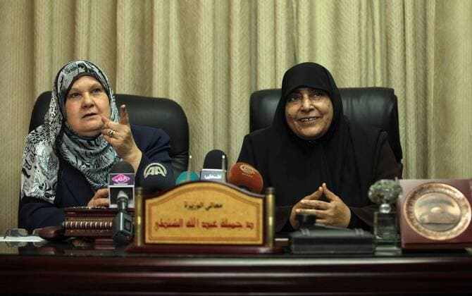 June 8, 2014 - Gaza City, Gaza Strip, Palestinian Territory - Former Palestinian Minister of Women s Affairs, Jamila al-Shanti meets with new minister of woman s Affairs in the Palestinian unity government, Haifa Al-Agha, to hand over the ministry s duties, in Gaza City on June 08, 2014. A long-awaited government of national unity headed by Prime Minister Rami Hamdallah was sworn in by President Mahmoud Abbas in the West Bank in Ramallah city For the first time in seven years, the Palestinians have one government in charge of both the West Bank and the Gaza Strip - ZUMAap3