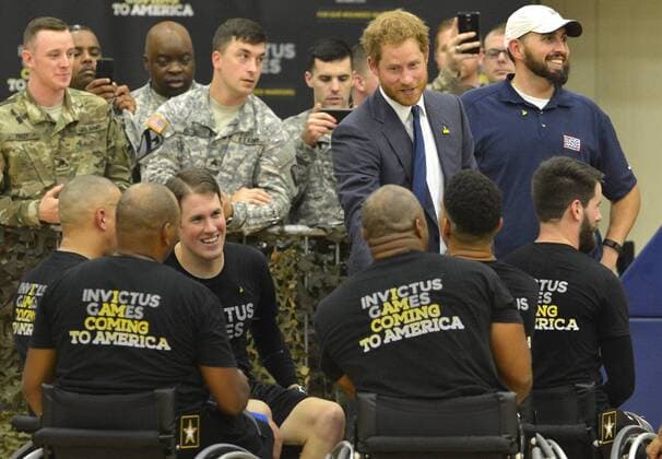 HRH Prince Harry thanks members of the basketball team at the conclusion of a game by wounded service members, October 28, 2015, at Ft. Belvoir, Virginia. The event is a celebration of the Joining Forces Initiative and the upcoming 2016 Invictus Games in Orlando, Florida, in which wounded military personnel compete in sporting competition.  WAP201510285012 MIKExTHEILER