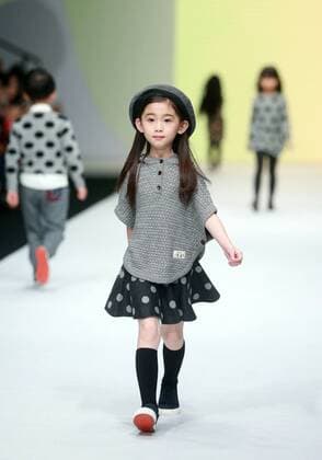 BEIJING, Oct. 28, 2015 -- A child model presents a creation designed by Li Lieqing at the M.latin Children s Wear Collection during the China Fashion Week in Beijing, capital of China, Oct. 28, 2015. ) (ry) CHINA-BEIJING-FASHION WEEK (CN) ChenxJiannan 