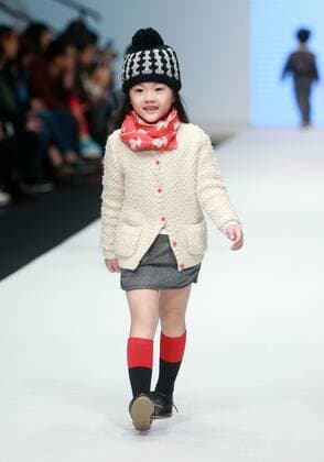 BEIJING, Oct. 28, 2015 -- A child model presents a creation designed by Li Lieqing at the M.latin Children s Wear Collection during the China Fashion Week in Beijing, capital of China, Oct. 28, 2015. ) (ry) CHINA-BEIJING-FASHION WEEK (CN) ChenxJiannan 