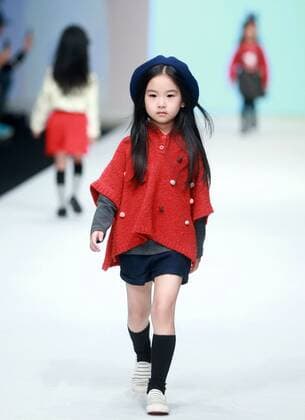 BEIJING, Oct. 28, 2015 -- A child model presents a creation designed by Li Lieqing at the M.latin Children s Wear Collection during the China Fashion Week in Beijing, capital of China, Oct. 28, 2015. ) (ry) CHINA-BEIJING-FASHION WEEK (CN) ChenxJiannan 