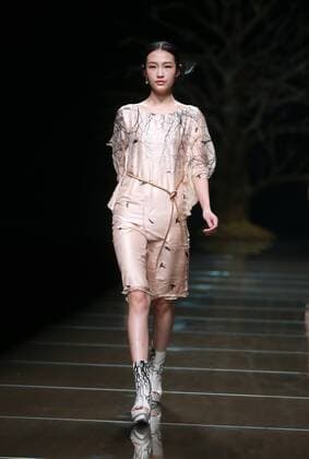 BEIJING, CHINA - OCTOBER 29: (CHINA OUT) A model showcases designs on the runway at 95 Secret Deng Zhaoping Collection during the Mercedes-Benz China Fashion Week Spring Summer 2016 at Beijing Hotel on October 29, 2015 in Beijing, China.  CFP475107097