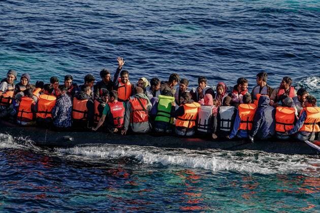 Nov. 5, 2015 - Cesme, Izmir, Turkey - Migrants and refugees disembark on a raft to the Greek island of Chios from Cesme in the Turkish province of Izmir on November 5, 2015. Up to 600,000 migrants and refugees are expected to cross from Turkey to Greece and onwards over the next four months, the UN said Novewmber 5, with the flow set to persist through the winter. The UN refugee agency (UNHCR) released the figures in a planning document that highlights the additional needs of migrants moving toward or within Europe as the weather turns cold. Cesme Turkey  - ZUMAn230