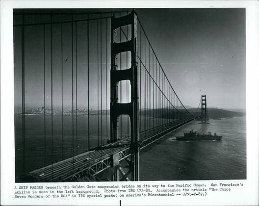 1968 - A Ship Passes beneath the Golden Gate suspension bridge on it way to the Pacific Ocean. San Francisco s skyline is seen in the left background. - ZUMAk09_