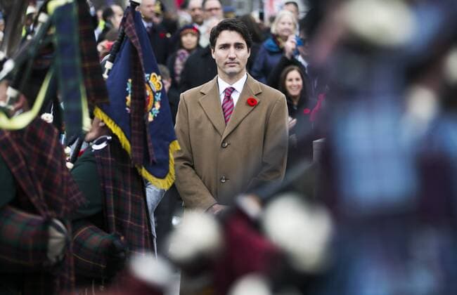 (151111) -- OTTAWA, Nov. 11, 2015 -- Canadian Prime Minister Justin Trudeau takes part in Remembrance Day ceremonies at the National War Memorial in Ottawa, Canada, Nov. 11, 2015. ) CANADA-OTTAWA-REMEMBERANCE DAY ChrisxRoussakis 