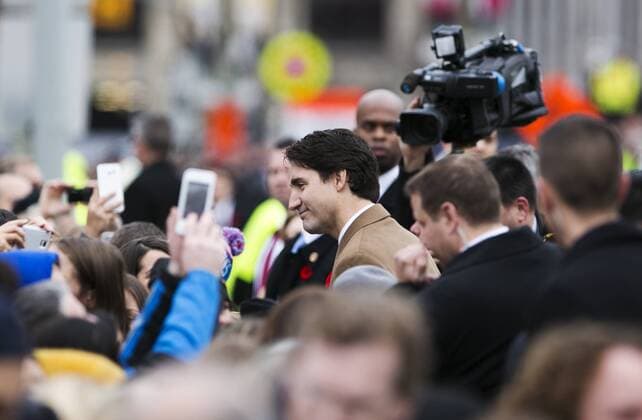 (151111) -- OTTAWA, Nov. 11, 2015 -- Canadian Prime Minister Justin Trudeau greets spectators during Remembrance Day ceremonies at the National War Memorial in Ottawa, Canada, Nov. 11, 2015. ) CANADA-OTTAWA-REMEMBERANCE DAY ChrisxRoussakis 